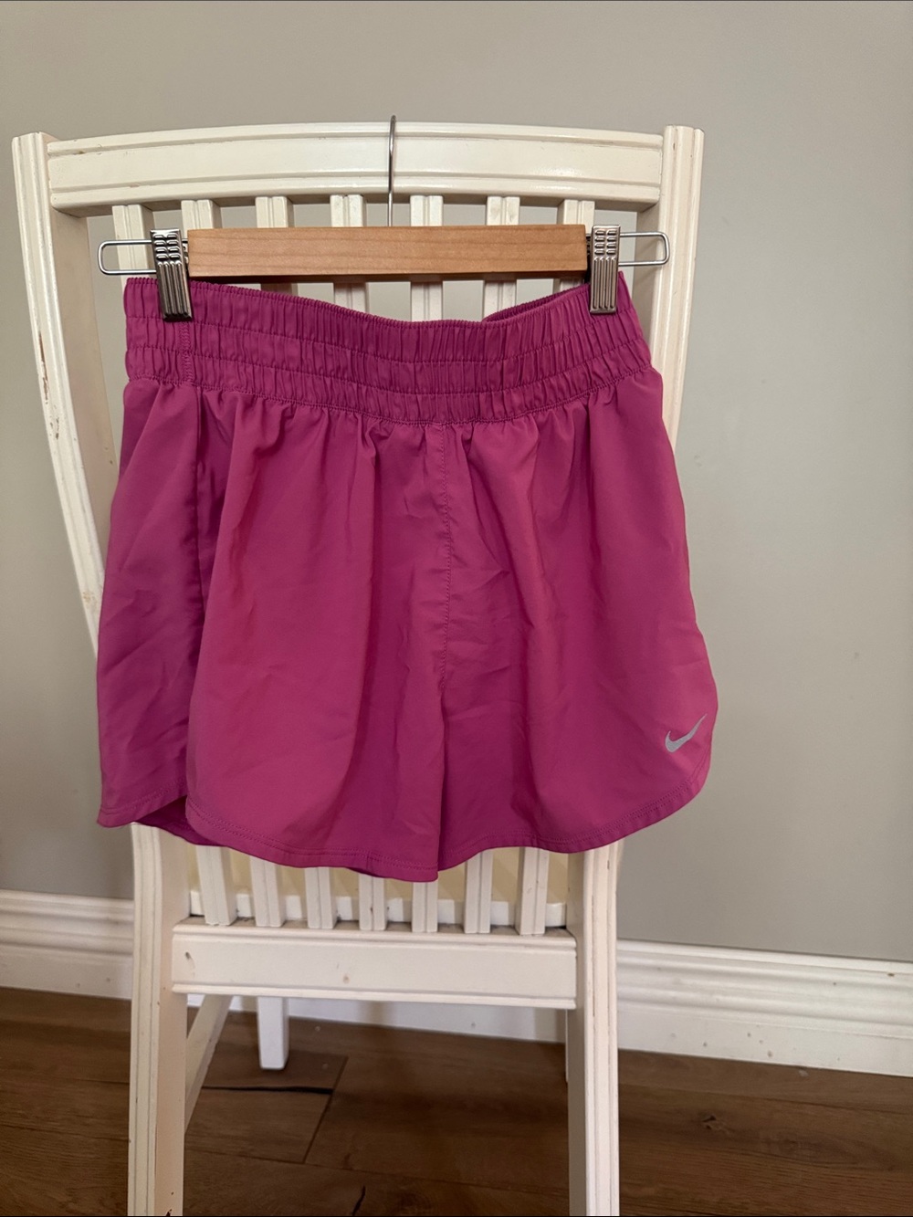 Nike Women's Pink Athletic Shorts with Silver Swoosh